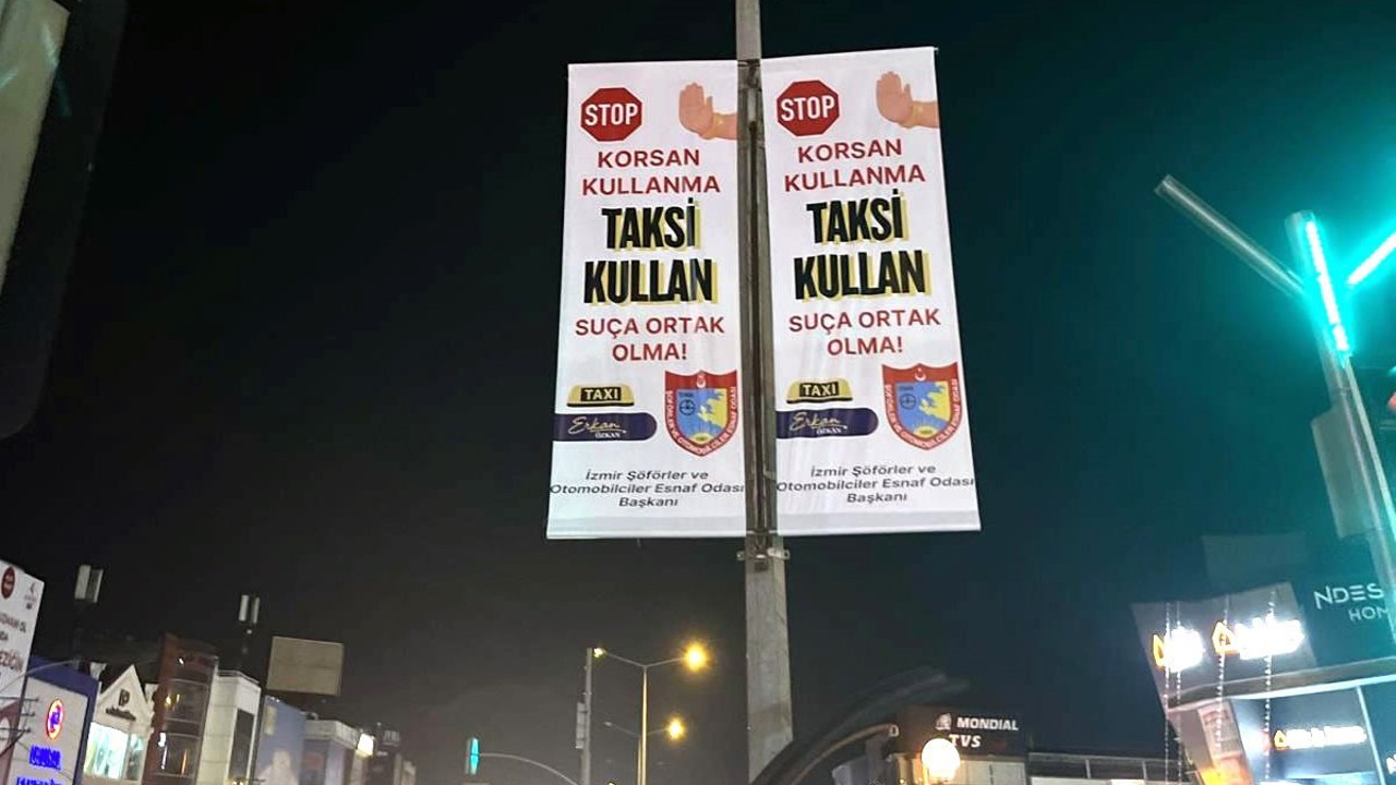 İzmirli taksiciler şehir geneline "korsan kullanma" afişleri astı
